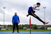 18 May 2020; Coach Dermot McGranaghan watches on at hurdler Joseph Gillespie of Finn Valley Athletic Club during a training session at the Finn Valley Centre in Stranorlar, Donegal, as athletics resumes having previously suspended all activity following directives from the Irish Government in an effort to contain the spread of the Coronavirus (COVID-19). Athletics clubs in the Republic of Ireland resumed activity on May 18th under the Irish government’s Roadmap for Reopening of Society and Business following strict protocols of social distancing and hand sanitisation among others allowing it to return in a phased manner. Photo by Stephen McCarthy/Sportsfile