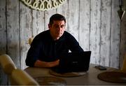20 May 2020; Derry City manager Declan Devine works on his laptop in his kitchen at his home in Bridgend, Donegal. Photo by Stephen McCarthy/Sportsfile