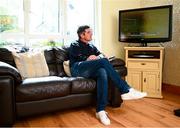 20 May 2020; Derry City manager Declan Devine watches a recording of his team on television at home in Bridgend, Donegal. Photo by Stephen McCarthy/Sportsfile