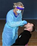 25 May 2020; Lu Kellett, Advanced Medical Services, conducts a COVID-19 swab test on Shamrock Rovers player Jack Byrne at their training facility, Roadstone Group Sports Club, in Dublin. Irish football took the first steps on the pathway to a safer return for all football when testing for COVID-19 began on Monday as part of the pilot programme and tournament for the four SSE Airtricity League clubs who will compete in Europe this year as Dundalk, Shamrock Rovers, Derry City and Bohemians prepare for a return to training. Players and staff from all four clubs were tested as the FAI continues to work on a pathway for a safer return for all Irish football in the coming months, under the supervision of Medical Director Dr Alan Byrne. Dr Byrne, a member of the Government’s Return to Sport expert group, has overseen the pilot programme for the four clubs that will inform all decisions on a pathway for Irish football to return in a safe environment by the end of August. The pilot tournament, featuring the four European qualified SSE Airtricity League teams, is planned for later this summer with the clubs scheduled to resume training on June 8th. Photo by Stephen McCarthy/Sportsfile