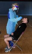 25 May 2020; Lu Kellett, Advanced Medical Services, conducts a COVID-19 swab test on Shamrock Rovers player Jack Byrne at their training facility, Roadstone Group Sports Club, in Dublin. Irish football took the first steps on the pathway to a safer return for all football when testing for COVID-19 began on Monday as part of the pilot programme and tournament for the four SSE Airtricity League clubs who will compete in Europe this year as Dundalk, Shamrock Rovers, Derry City and Bohemians prepare for a return to training. Players and staff from all four clubs were tested as the FAI continues to work on a pathway for a safer return for all Irish football in the coming months, under the supervision of Medical Director Dr Alan Byrne. Dr Byrne, a member of the Government’s Return to Sport expert group, has overseen the pilot programme for the four clubs that will inform all decisions on a pathway for Irish football to return in a safe environment by the end of August. The pilot tournament, featuring the four European qualified SSE Airtricity League teams, is planned for later this summer with the clubs scheduled to resume training on June 8th. Photo by Stephen McCarthy/Sportsfile