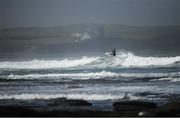 26 May 2020; A surfer rides a wave at Lahinch in Clare. Photo by Seb Daly/Sportsfile