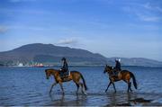 3 June 2020; Leanne Breen on La Novia, left, and Aili Leah on Lottieloveheart during a morning ride on Greencastle Beach in Greencastle, Co. Down. Horse racing is due to return behind closed doors on June 8, after racing was suspended in an effort to contain the spread of the Coronavirus (COVID-19) pandemic. Photo by Ramsey Cardy/Sportsfile