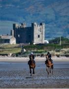 3 June 2020; Aili Leah on Lottieloveheart, left, and Leanne Breen on La Novia during a morning ride on Greencastle Beach in Greencastle, Co. Down. Horse racing is due to return behind closed doors on June 8, after racing was suspended in an effort to contain the spread of the Coronavirus (COVID-19) pandemic. Photo by Ramsey Cardy/Sportsfile