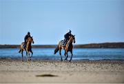 3 June 2020; Aili Leah on Lottieloveheart, right, and Leanne Breen on La Novia during a morning ride on Greencastle Beach in Greencastle, Co. Down. Horse racing is due to return behind closed doors on June 8, after racing was suspended in an effort to contain the spread of the Coronavirus (COVID-19) pandemic. Photo by Ramsey Cardy/Sportsfile