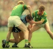 30 July 1995; Paul Curran of Dublin in action against John McDermott, left, and Trevor Giles of Meath during the Bank of Ireland Leinster Senior Football Championship Final match between Dublin and Meath at Croke Park in Dublin. Photo by Ray McManus/Sportsfile