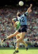 30 July 1995; Paul Clarke of Dublin scores his side's first goal despite the attempted tackle from Cormac Murphy of Meath during the Bank of Ireland Leinster Senior Football Championship Final match between Dublin and Meath at Croke Park in Dublin. Photo by Brendan Moran/Sportsfile