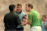 30 July 1995; Charlie Redmond of Dublin and Robbie O'Malley of Meath remonstrate with referee Pat Casserly during the Bank of Ireland Leinster Senior Football Championship Final match between Dublin and Meath at Croke Park in Dublin. Photo by Ray McManus/Sportsfile