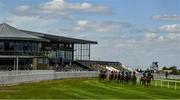 8 June 2020; A general view as runners and riders pass the empty grand stand during the Irish Stallion Farms EBF Fillies Maiden at Naas Races in Kildare. Horse racing has been allowed to resume on June 8 under the Irish Government’s Roadmap for Reopening of Society and Business following strict protocols of social distancing and hand sanitisation among others allowing it to return in a phased manner, having been suspended from March 25 due to the Irish Government's efforts to contain the spread of the Coronavirus (COVID-19) pandemic. Photo by Harry Murphy/Sportsfile