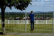8 June 2020; A Punter looks on during the Clinton Higgins Chartered Accountants Handicap (DIV II) at Naas Races in Kildare. Horse racing has been allowed to resume on June 8 under the Irish Government’s Roadmap for Reopening of Society and Business following strict protocols of social distancing and hand sanitisation among others allowing it to return in a phased manner, having been suspended from March 25 due to the Irish Government's efforts to contain the spread of the Coronavirus (COVID-19) pandemic. Photo by Harry Murphy/Sportsfile