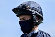 8 June 2020; Jockey Michael Hussey wears a protective mask at Naas Races in Kildare. Horse racing has been allowed to resume on June 8 under the Irish Government’s Roadmap for Reopening of Society and Business following strict protocols of social distancing and hand sanitisation among others allowing it to return in a phased manner, having been suspended from March 25 due to the Irish Government's efforts to contain the spread of the Coronavirus (COVID-19) pandemic. Photo by Brendan Moran/Sportsfile