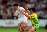 30 June 2001; John Doyle, Kildare, in action against Mark Crossan Donegal. Kildare v Donegal, Bank of Ireland All-Ireland Football Championship Qualifier, St. Conleth's Park, Newbridge, Co. Kildare. Photo by Damien Eagers/Sportsfile