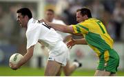 30 June 2001; Dermot Earley, Kildare, in action against Donegal's Noel McGinley. Kildare v Donegal, Bank of Ireland All-Ireland Championship Qualifier, St Conleths Park, Newbridge, Co. Kildare. Photo by Damien Eagers/Sportsfile
