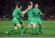 11 June 2002; Gary Breen, Kevin Kilbane and Ian Harte celebrate with Robbie Keane, Republic of Ireland, after he had scored the first goal against Saudi Arabia. FIFA World Cup Finals, Group E, Republic of Ireland v Saudi Arabia, Yokohama Stadium, Yokohama, Japan. Photo by David Maher/Sportsfile