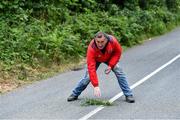 8 June 2020; Tom Dennehy, Road Shower for his son Shane Dennehy of Bweeng, places down a guide marker for his next shot during his match against Donncha Spillane of Ballinagree in the North Cork Boys U16 Road Bowling Championships at Kilcorney, Cork. Road Bowling in the Republic of Ireland has been allowed to resume from June 8 under the Irish Government’s Roadmap for Reopening of Society and Business following strict protocols of social distancing and hand sanitisation among other measures allowing it to return in a phased manner. Photo by Piaras Ó Mídheach/Sportsfile