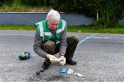 8 June 2020; Willie Murphy, Treasurer of the North Cork Region, and uncle of former Cork ladies footballer Juliet Murphy, wipes the bowls with sanitising wipes before the match between Shane Dennehy of Bweeng and Donncha Spillane of Ballinagree in the North Cork Boys U16 Road Bowling Championships at Kilcorney, Cork. Road Bowling in the Republic of Ireland has been allowed to resume from June 8 under the Irish Government’s Roadmap for Reopening of Society and Business following strict protocols of social distancing and hand sanitisation among other measures allowing it to return in a phased manner. Photo by Piaras Ó Mídheach/Sportsfile