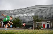 14 June 2020; Havelock Square residents Paddy Allen, age 7, left, takes a shot on his friend Johnny Murphy, age 8, during a kickabout on Havelock Square in the shadow of the Aviva Stadium in Dublin. Monday 15 June 2020 was the scheduled date for the opening game in Dublin of UEFA EURO 2020, the Group E opener between Poland and Play-off B Winner. UEFA EURO 2020, to be held in 12 European cities across 12 UEFA countries, was originally scheduled to take place from 12 June to 12 July 2020. On 17 March 2020, UEFA announced that the tournament would be delayed by a year due to the COVID-19 pandemic in Europe, and proposed it take place from 11 June to 11 July 2021. Photo by Stephen McCarthy/Sportsfile