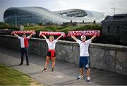 14 June 2020; Poland supporters, from left, Pawel Cherek, from Ongar, Dublin, Magda Boruc and Bart Boruc, both from Naas, Kildare, pose for a portrait near the Aviva Stadium in Dublin. Monday 15 June 2020 was the scheduled date for the opening game in Dublin of UEFA EURO 2020, the Group E opener between Poland and Play-off B Winner. UEFA EURO 2020, to be held in 12 European cities across 12 UEFA countries, was originally scheduled to take place from 12 June to 12 July 2020. On 17 March 2020, UEFA announced that the tournament would be delayed by a year due to the COVID-19 pandemic in Europe, and proposed it take place from 11 June to 11 July 2021. Photo by Stephen McCarthy/Sportsfile