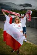 14 June 2020; Poland supporters, from left, Pawel Cherek, from Ongar, Dublin, Magda Boruc and Bart Boruc, both from Naas, Kildare, pose for a portrait near the Aviva Stadium in Dublin. Monday 15 June 2020 was the scheduled date for the opening game in Dublin of UEFA EURO 2020, the Group E opener between Poland and Play-off B Winner. UEFA EURO 2020, to be held in 12 European cities across 12 UEFA countries, was originally scheduled to take place from 12 June to 12 July 2020. On 17 March 2020, UEFA announced that the tournament would be delayed by a year due to the COVID-19 pandemic in Europe, and proposed it take place from 11 June to 11 July 2021. Photo by Stephen McCarthy/Sportsfile