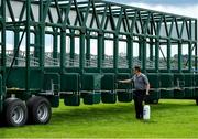 15 June 2020; A stall handler sprays disinfectant on the stalls prior to racing at Roscommon Racecourse in Roscommon. Horse racing has been allowed to resume from June 8 under the Irish Government’s Roadmap for Reopening of Society and Business following strict protocols of social distancing and hand sanitisation among others allowing it to return in a phased manner, having been suspended from March 25 due to the Irish Government's efforts to contain the spread of the Coronavirus (COVID-19) pandemic. Photo by Seb Daly/Sportsfile