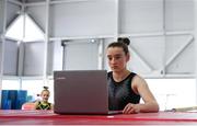 15 June 2020; Team Ireland gymnast Jane Heffernan sets up a video call to her coach during their return to the National Gymnastics Training Centre in the Sport Ireland Campus in Dublin. Seven high-performance Gymnastics Ireland gymnasts plus support staff have been approved for return to training under Sport Ireland and the Irish Government’s Roadmap for Reopening of Society and Business following strict protocols of social distancing and hand sanitisation among other measures allowing it to return in a phased manner, having been suspended since March due to the Irish Government's efforts to contain the spread of the Coronavirus (COVID-19) pandemic. Photo by Ramsey Cardy/Sportsfile
