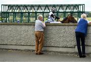 15 June 2020; Spectators Peter Hennigan, from Rockfield, Roscommon, and Ann Mahon, from Drinaun, Roscommon, watch as horses are loaded into the stalls prior to the www.roscommonracecourse.ie Handicap at Roscommon Racecourse in Roscommon. Horse racing has been allowed to resume from June 8 under the Irish Government’s Roadmap for Reopening of Society and Business following strict protocols of social distancing and hand sanitisation among others allowing it to return in a phased manner, having been suspended from March 25 due to the Irish Government's efforts to contain the spread of the Coronavirus (COVID-19) pandemic. Photo by Seb Daly/Sportsfile