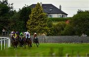 15 June 2020; Spectators watch from outside of the racecourse as the field passes them during the Irish Stallion Farms EBF Median Auction (C & G) Maiden at Roscommon Racecourse in Roscommon. Horse racing has been allowed to resume from June 8 under the Irish Government’s Roadmap for Reopening of Society and Business following strict protocols of social distancing and hand sanitisation among others allowing it to return in a phased manner, having been suspended from March 25 due to the Irish Government's efforts to contain the spread of the Coronavirus (COVID-19) pandemic. Photo by Seb Daly/Sportsfile