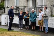 17 June 2020; Professional boxer and member of An Garda Síochána Niall Kennedy speaks with residents of Crinion Park during a PPE drop-off while on duty out of Wicklow Garda Station. Photo by Stephen McCarthy/Sportsfile