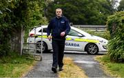 17 June 2020; Professional boxer and member of An Garda Síochána Niall Kennedy during a routine visit to a house while on duty out of Wicklow Garda Station. Photo by Stephen McCarthy/Sportsfile