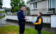 17 June 2020; Professional boxer and member of An Garda Síochána Niall Kennedy speaks with Crinion Park resident Pixie Beamish during a PPE drop-off while on duty out of Wicklow Garda Station. Photo by Stephen McCarthy/Sportsfile