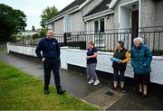 17 June 2020; Professional boxer and member of An Garda Síochána Niall Kennedy speaks with residents of Crinion Park during a PPE drop-off while on duty out of Wicklow Garda Station. Photo by Stephen McCarthy/Sportsfile