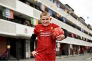 17 June 2020; NOW TV surprised Liverpool superfan Sean McCabe (11) and the residents of Canon Mooney Gardens in Ringsend with a special message from Liverpool legend Jamie Carragher. To show its appreciation for their enduring community spirit, NOW TV also gifted all residents with NOW TV Sky Sports Passes so that they can watch the returning football games. Premier League action returns with a double-header today and all the action is available to stream on NOW TV. Pictured is Sean McCabe in Canon Mooney Gardens in Dublin. Photo by Sam Barnes/Sportsfile