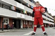 17 June 2020; NOW TV surprised Liverpool superfan Sean McCabe (11) and the residents of Canon Mooney Gardens in Ringsend with a special message from Liverpool legend Jamie Carragher. To show its appreciation for their enduring community spirit, NOW TV also gifted all residents with NOW TV Sky Sports Passes so that they can watch the returning football games. Premier League action returns with a double-header today and all the action is available to stream on NOW TV. Pictured is Sean McCabe in Canon Mooney Gardens in Dublin. Photo by Sam Barnes/Sportsfile