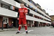 17 June 2020; NOW TV surprised Liverpool superfan Sean McCabe (11) and the residents of Canon Mooney Gardens in Ringsend with a special message from Liverpool legend Jamie Carragher. To show its appreciation for their enduring community spirit, NOW TV also gifted all residents with NOW TV Sky Sports Passes so that they can watch the returning football games. Premier League action returns with a double-header today and all the action is available to stream on NOW TV. Pictured is Sean McCabe in Canon Mooney Gardens in Dublin. Photo by Sam Barnes/Sportsfile