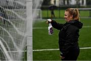 19 June 2020; Coach Emma Donohoe sanitzes the goalposts prior to a Peamount United squad training session in Greenogue in Newcastle, Dublin. Following approval from the Football Association of Ireland and the Irish Government, a number of national league teams have been allowed to resume collective training. On March 12, the FAI announced the cessation of all football under their jurisdiction upon directives from the Irish Government, the Department of Health and UEFA, in an effort to contain the spread of the Coronavirus (COVID-19) pandemic. Photo by David Fitzgerald/Sportsfile