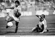 21 June 1990; Frank Rijkaard of Netherlands in action against Niall Quinn of Republic of Ireland during the FIFA World Cup 1990 Group F match between Republic of Ireland and Netherlands at Stadio La Favorita in Palermo, Italy. Photo by Ray McManus/Sportsfile