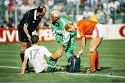 21 June 1990; Referee Michel Vautrot speaks to Republic of Ireland physio Mick Byrne as he gives assistance to Niall Quinn during the FIFA World Cup 1990 Group F match between Republic of Ireland and Netherlands at Stadio La Favorita in Palermo, Italy. Photo by Ray McManus/Sportsfile