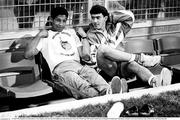 21 June 1990; Republic of Ireland players Chris Hughton, left, and Alan McLoughlin sit on the bench prior to the FIFA World Cup 1990 Group F match between Republic of Ireland and Netherlands at Stadio La Favorita in Palermo, Italy. Photo by Ray McManus/Sportsfile