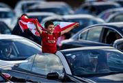 21 June 2020; Liverpool supporter, Max Ellis, age 9, from Clondalkin, Co Dublin, watches the English Premier League merseyside derby match between Everton and Liverpool at Goodison Park from a Drive In Theatre showing the game on Sky TV at the RDS Arena in Dublin. Due to the restrictions imposed by both Governments on non essential travel to help contain the spread of the Coronavirus (COVID-19) pandemic, supporters have not discouraged from travelling. Research published in 2015 estimated that out of 800,000 people that travelled to the UK to watch a football game every year, 121,000 travelled from Ireland.  Photo by David Fitzgerald/Sportsfile