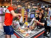 22 June 2020; Monaleen GAA player Daniel Power at the check out with Miriam Costello in SuperValu castletroy after shopping on behalf of The Sisters of the Little Company of Mary in Milford, Limerick. GAA clubs nationwide help out their local communities during restrictions imposed by the Irish Government in an effort to contain the spread of the Coronavirus (COVID-19) pandemic. GAA facilities reopened on Monday June 8 for the first time since March 25 with club matches provisionally due to start on July 31 and intercounty matches due to to take place no sooner that October 17. Photo by Eóin Noonan/Sportsfile
