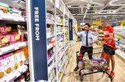 22 June 2020; Monaleen GAA player Daniel Power is assisted by Nathan Nahar, assistant manager, while shopping in SuperValu castletroy on behalf of The Sisters of the Little Company of Mary in Milford, Limerick. GAA clubs nationwide help out their local communities during restrictions imposed by the Irish Government in an effort to contain the spread of the Coronavirus (COVID-19) pandemic. GAA facilities reopened on Monday June 8 for the first time since March 25 with club matches provisionally due to start on July 31 and intercounty matches due to to take place no sooner that October 17. Photo by Eóin Noonan/Sportsfile