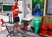 22 June 2020; Monaleen GAA player Daniel Power sanitizes before shopping in SuperValu castletroy on behalf of The Sisters of the Little Company of Mary in Milford, Limerick. GAA clubs nationwide help out their local communities during restrictions imposed by the Irish Government in an effort to contain the spread of the Coronavirus (COVID-19) pandemic. GAA facilities reopened on Monday June 8 for the first time since March 25 with club matches provisionally due to start on July 31 and intercounty matches due to to take place no sooner that October 17. Photo by Eóin Noonan/Sportsfile