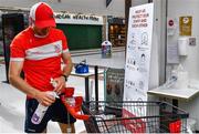 22 June 2020; Monaleen GAA player Daniel Power sanitizes before shopping in SuperValu castletroy on behalf of The Sisters of the Little Company of Mary in Milford, Limerick. GAA clubs nationwide help out their local communities during restrictions imposed by the Irish Government in an effort to contain the spread of the Coronavirus (COVID-19) pandemic. GAA facilities reopened on Monday June 8 for the first time since March 25 with club matches provisionally due to start on July 31 and intercounty matches due to to take place no sooner that October 17. Photo by Eóin Noonan/Sportsfile