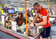 22 June 2020; Monaleen GAA player Daniel Power at the check out with Miriam Costello in SuperValu castletroy after shopping on behalf of The Sisters of the Little Company of Mary in Milford, Limerick. GAA clubs nationwide help out their local communities during restrictions imposed by the Irish Government in an effort to contain the spread of the Coronavirus (COVID-19) pandemic. GAA facilities reopened on Monday June 8 for the first time since March 25 with club matches provisionally due to start on July 31 and intercounty matches due to to take place no sooner that October 17. Photo by Eóin Noonan/Sportsfile