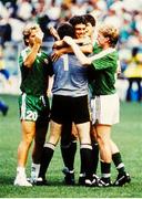 25 June 1990; David O'Leary and goalkeeer Packie Bonner celebrate with team-mates John Byrne, Niall Quinn and Steve Staunton after the FIFA World Cup 1990 Round of 16 match between Republic of Ireland and Romania at the Stadio Luigi Ferraris in Genoa, Italy. Photo by Ray McManus/Sportsfile