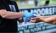 24 June 2020; Cully Hayden, Covid Supervisor, gives hand sanitiser to a player before a Moorefield Senior Football Squad training session at Moorefield GAA club in Newbridge, Kildare. Following approval from the GAA and the Irish Government, the GAA released its safe return to play protocols, allowing pitches to be opened for non contact training on 24 June and for training and challenge games to resume from 29 June. On March 25, the GAA announced the cessation of all GAA activities and closures of all GAA facilities under their jurisdiction upon directives from the Irish Government in an effort to contain the Coronavirus (COVID-19) pandemic. Photo by Piaras Ó Mídheach/Sportsfile