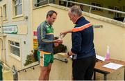 25 June 2020; Michael Murphy receives sanitizer from team official Paul Gallagher on arrival to a Glenswilly GAA Club training session at Glenkerragh in Donegal. Following approval from the GAA and the Irish Government, the GAA released its safe return to play protocols, allowing pitches to be opened for non contact training on 24 June and for training and challenge games to resume from 29 June. On March 25, the GAA announced the cessation of all GAA activities and closures of all GAA facilities under their jurisdiction upon directives from the Irish Government in an effort to contain the Coronavirus (COVID-19) pandemic. Photo by Oliver McVeigh/Sportsfile