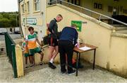 25 June 2020; Paul Gallagher, team official, completing health forms and sanitizing the officalls and players before a Glenswilly GAA Club training session at Glenkerragh in Donegal. Following approval from the GAA and the Irish Government, the GAA released its safe return to play protocols, allowing pitches to be opened for non contact training on 24 June and for training and challenge games to resume from 29 June. On March 25, the GAA announced the cessation of all GAA activities and closures of all GAA facilities under their jurisdiction upon directives from the Irish Government in an effort to contain the Coronavirus (COVID-19) pandemic. Photo by Oliver McVeigh/Sportsfile