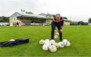 25 June 2020; Paul Gallagher, team official, sanitizing the balls before a Glenswilly GAA Club training session at Glenkerragh in Donegal. Following approval from the GAA and the Irish Government, the GAA released its safe return to play protocols, allowing pitches to be opened for non contact training on 24 June and for training and challenge games to resume from 29 June. On March 25, the GAA announced the cessation of all GAA activities and closures of all GAA facilities under their jurisdiction upon directives from the Irish Government in an effort to contain the Coronavirus (COVID-19) pandemic. Photo by Oliver McVeigh/Sportsfile
