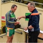 25 June 2020; Michael Murphy receives sanitizer from team official Paul Gallagher on arrival to a Glenswilly GAA Club training session at Glenkerragh in Donegal. Following approval from the GAA and the Irish Government, the GAA released its safe return to play protocols, allowing pitches to be opened for non contact training on 24 June and for training and challenge games to resume from 29 June. On March 25, the GAA announced the cessation of all GAA activities and closures of all GAA facilities under their jurisdiction upon directives from the Irish Government in an effort to contain the Coronavirus (COVID-19) pandemic. Photo by Oliver McVeigh/Sportsfile